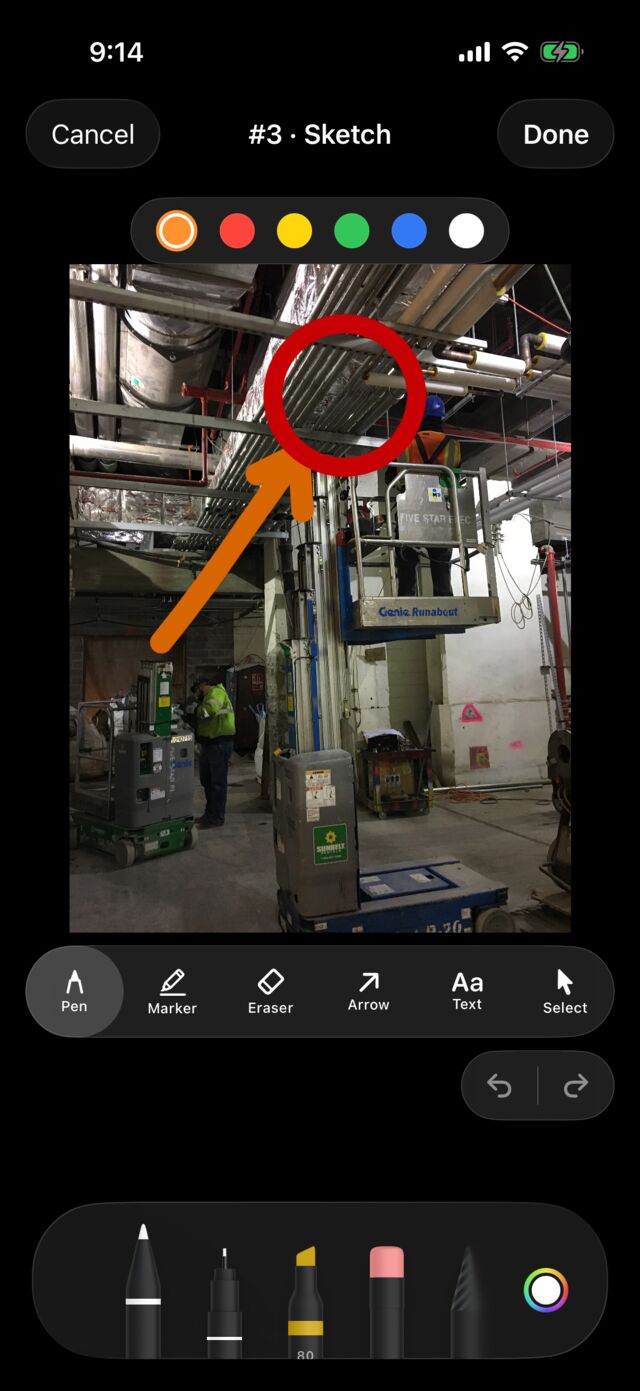 The Sitewise sketch editor: a red circle and an orange arrow drawn over a site photo to mark a defect, with the pen, marker, eraser and arrow tools below it